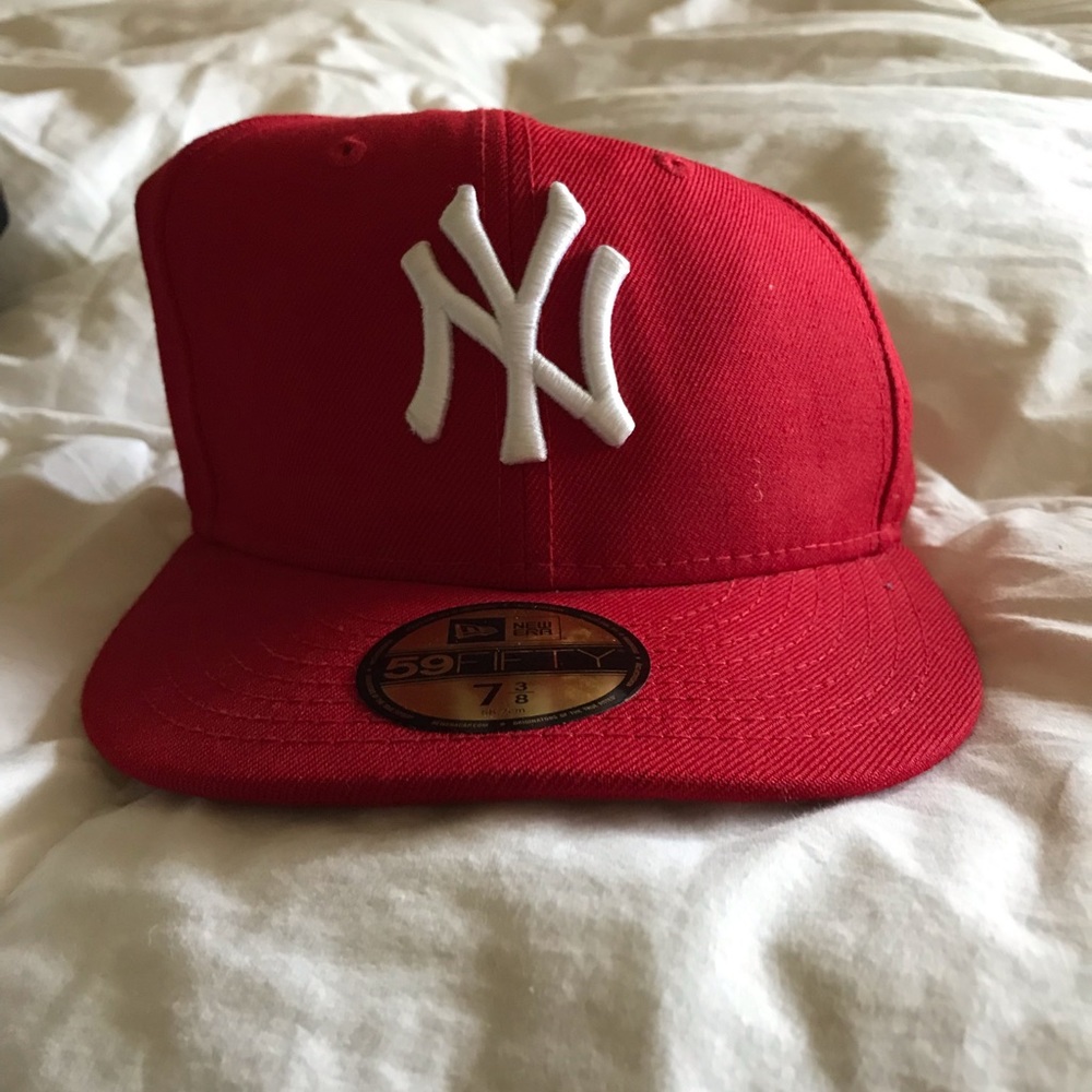 Yankees baseball cap.